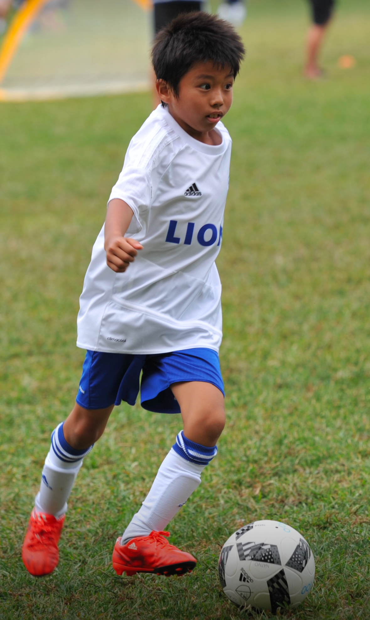 Bryan Lim with a soccer ball during his youth soccer years